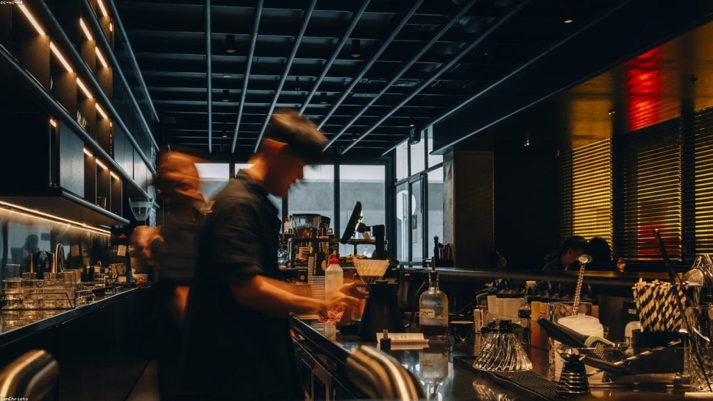 Barista preparing coffee in a modern cafe